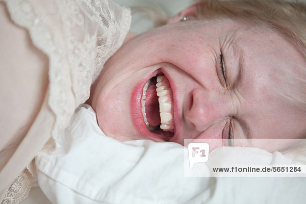 Face of young woman laughing