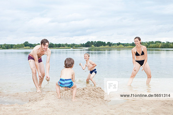 Family playing on a beach