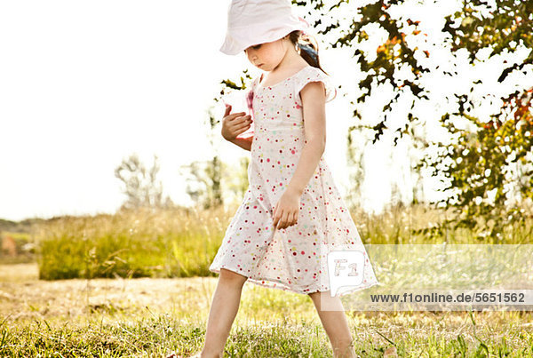 Little Girl walking im park