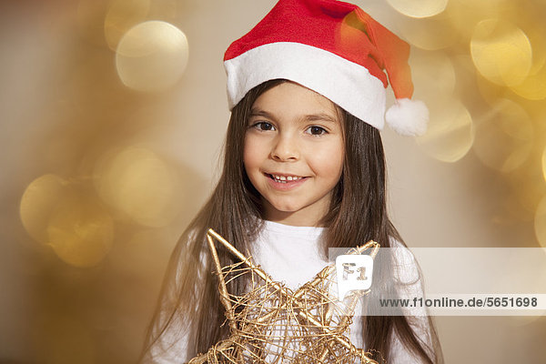 Girl with santa hat  smiling  portrait