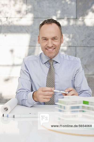Germany  Leipzig  Businessman with architectural model