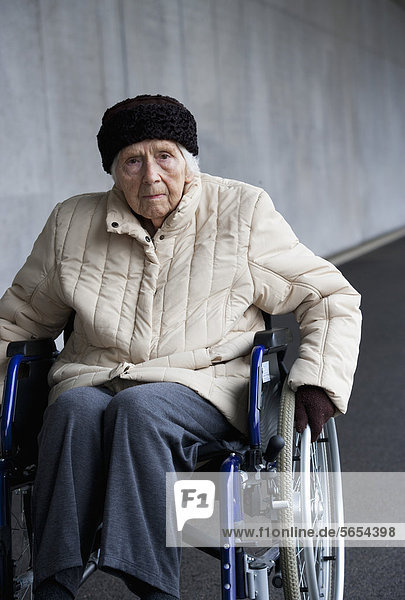 Austria  Senior woman on wheelchair at Subway