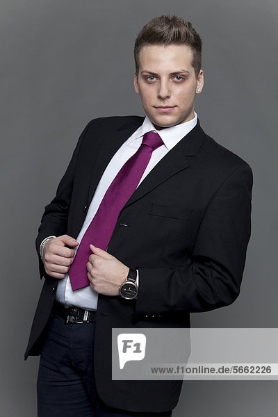 Young man  business look in suit and tie