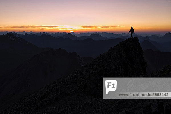 Mountain panorama with climber at sunset  Mt. Feuerspitze  Steeg  Lech  Ausserfern  Tyrol  Austria  Europe