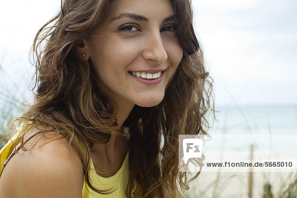 Smiling young woman outdoors  portrait