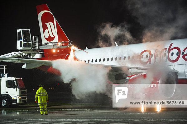 Airberlin aircraft  Airbus  being de-iced  Tegel Airport  Berlin  Germany  Europe