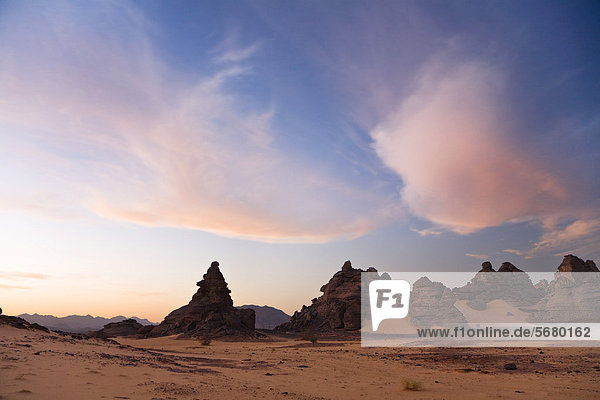 Clouds in the sky and rock formations in the Libyan Desert  Wadi Awis  Acacus Mountains  Libya  Africa