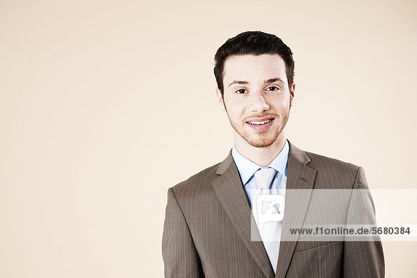 Young man smiling at camera  portrait