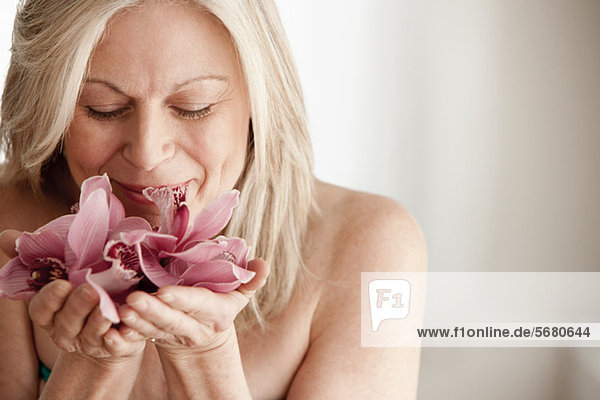Mature woman holding flower