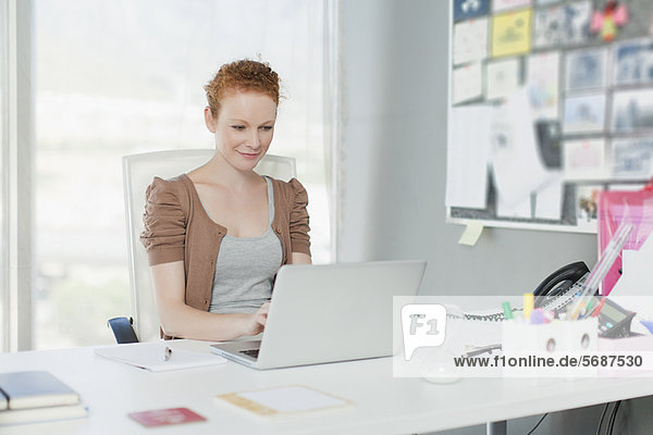 Businesswoman working on laptop