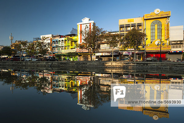 Street view reflected in a moat  Chiang Mai  Northern Thailand  Thailand  Asia