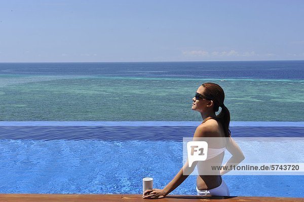 Philippines  Bohol  Eskaya Beach resort  woman in swimming pool                                                                                                                                     