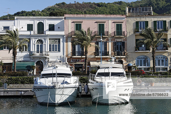 Two yachts moored in front of a row of houses  Casamicciola Terme  Ischia Island  Gulf of Naples  Campania  Southern Italy  Italy  Europe