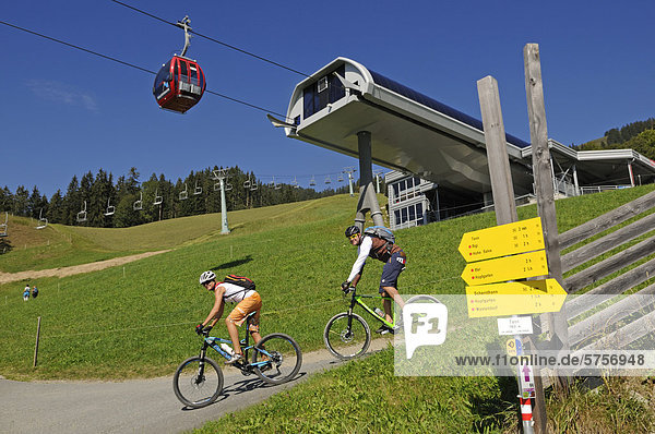 Mountain bikers  Salvenbahn cable car  Mt Hohe Salve  Kitzbuehel Alps  Tyrol  Austria  Europe