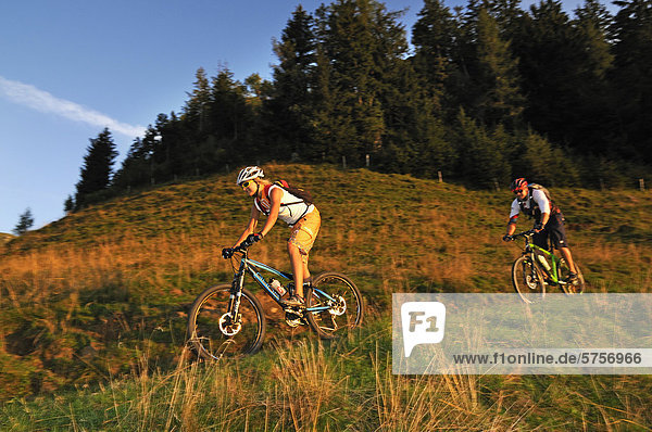 Mountain bikers at the Kraftalm alp  Mt Hohe Salve  Kitzbuehel Alps  Tyrol  Austria  Europe