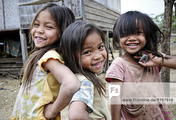 Three smiling girls  Laos  Southeast Asia  Asia