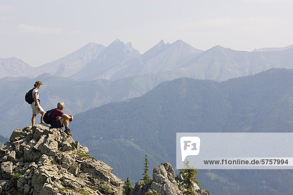 Senior couple enjoying the view of the Lizard Range near Fernie  British Columbia  Canada.