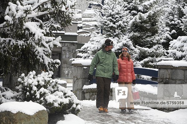 Young couple in Whistler Village  Whistler  British Columbia  Canada.