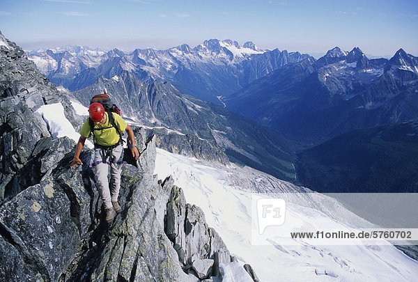 Rock climber  Anthony Comazzetto  climbing along the Asulkan Ridge traverse near the summit of Mount Jupiter  Rogers Pass  Glacier National Park  British Columbia  Canada