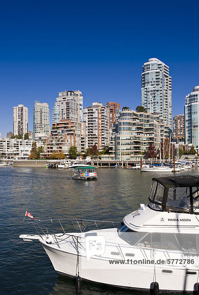 Yacht  Aquabus Ferry and buildings  False Creek  Vancouver  British Columbia  Canada