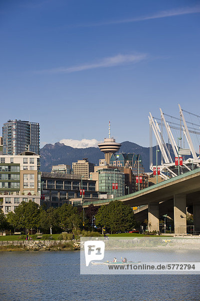Kayakers and Cambie Bridge  city skyline with new retractable roof on BC Place Stadium  False Creek  Vancouver  British Columbia  Canada