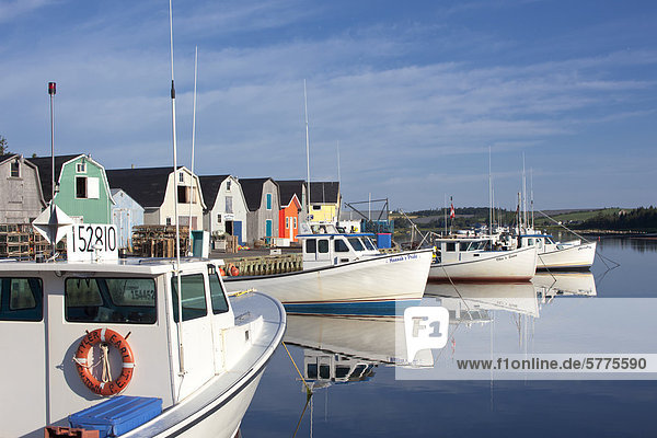 Fishing boats reflected in North Rustico Harbour  Prince Edward Island  Canada