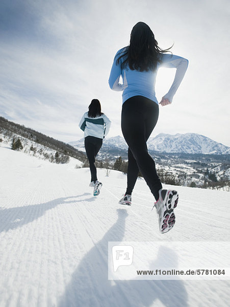 Women running in snow