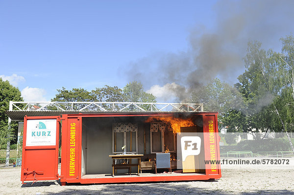 Demonstration of a room fire in a fire-container at the Feuerwehr Leonberg fire brigade Baden-Wuerttemberg Germany Europe