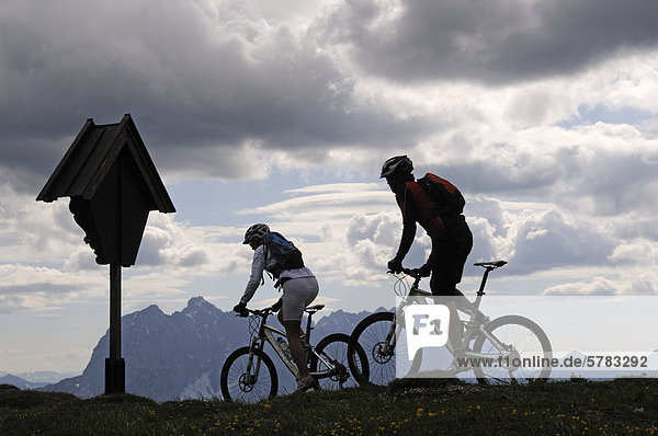 Mountain bikers  Eggenalm alp  Reit im Winkl  Chiemgau  Bavaria  Germany  Europe