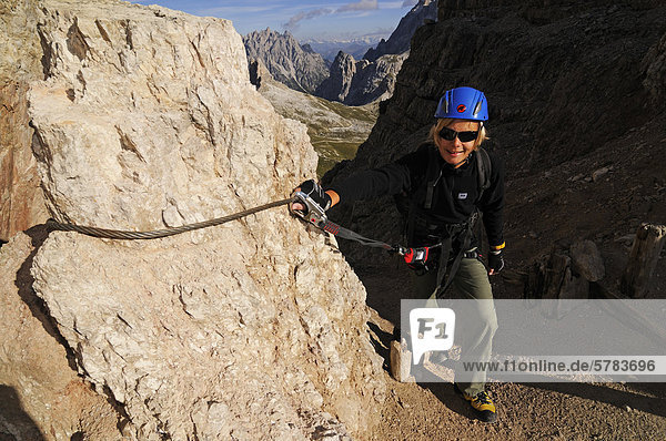 Teenager climbing on the Paternkofel fixed rope route  Hochpustertal valley  Dolomites  Province of Bolzano-Bozen  Italy  Europe