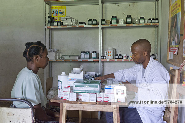 Patient receiving anti-retroviral medicines in an HIV-AIDS clinic from a pharmacist  Quelimane  Mozambique  Africa
