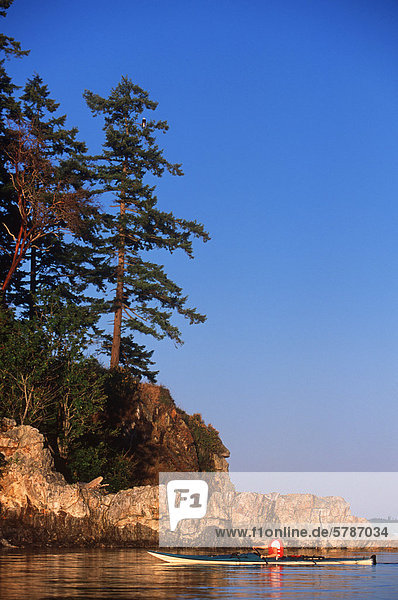 sea kayaker at Breton Islands near Quadra Island British Columbia Canada.