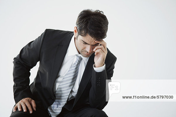 Businessman deep in thought facing difficulty