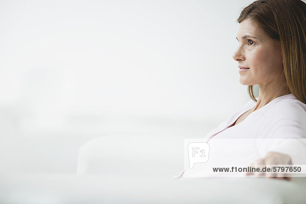 Mature woman deep in thought  side view