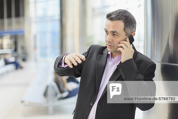 Mature businessman talking on mobile phone