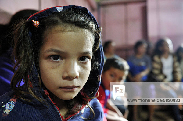 Girl during a meeting of an aid organisation that provides health services and information for mothers and children  portrait  Comunidad Martillo  Caaguaz_  Paraguay  South America