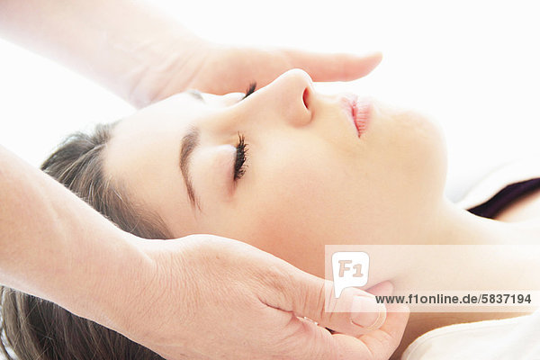 Woman having facial massage in spa