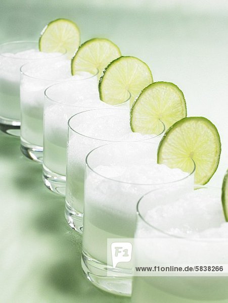 Drinks with ice cubes and slices of lime