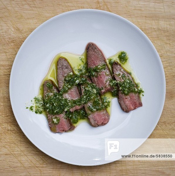 Sliced Steak Topped with Chimichurri Sauce