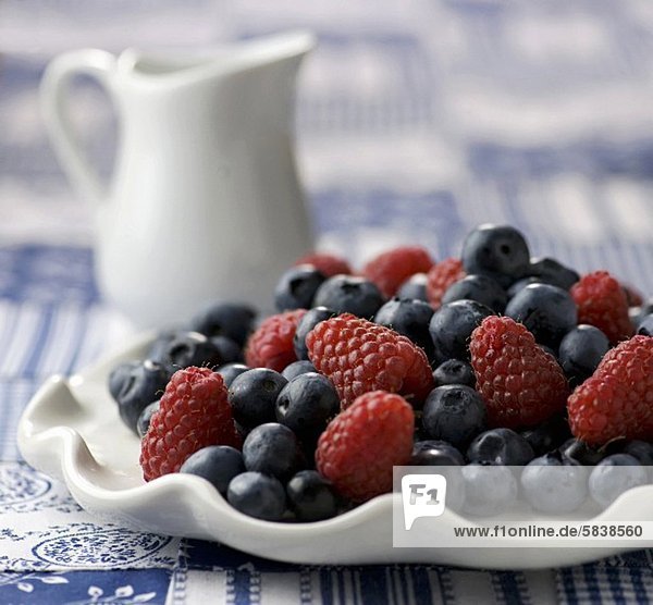 'Fresh Blueberries and Raspberries on a White Dish