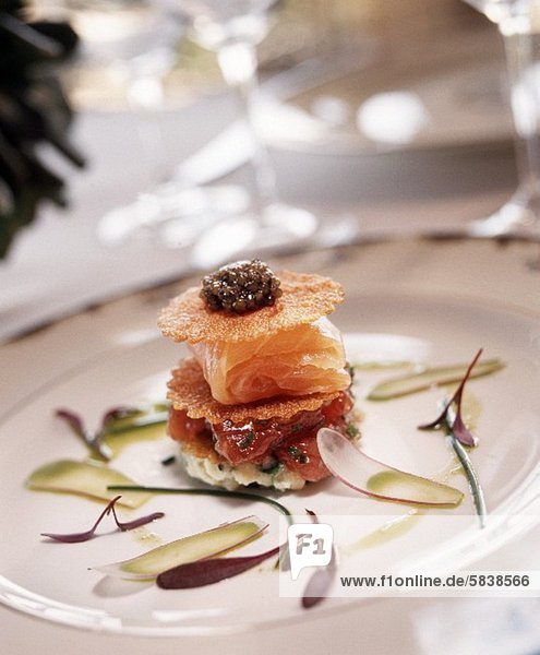 Salmon and Caviar Appetizer on a White Plate