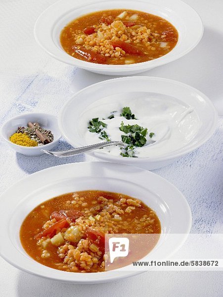 Red lentil soup with tomatoes  potatoes and sour cream