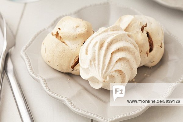 Three Meringues on a White Dish