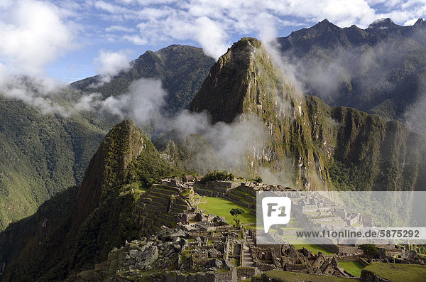 Inca ruins of Machu Picchu in the Andes  with fog  UNESCO World Heritage Site  Urubamba Valley  near Cusco  Peru  South America