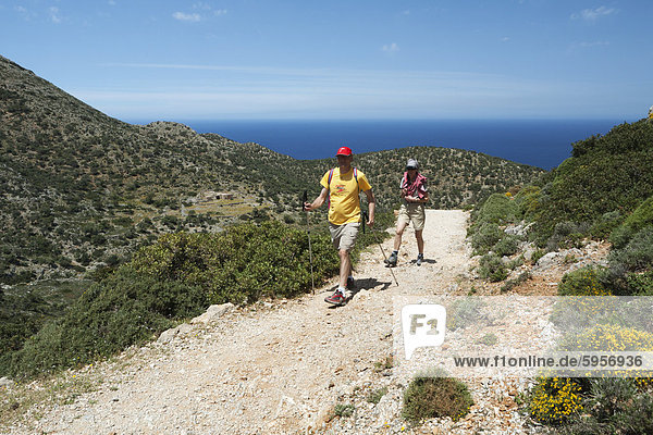 Walkers on coastal walk  Akrotiri Peninsula  Chania region  Crete  Greek Islands  Greece  Europe