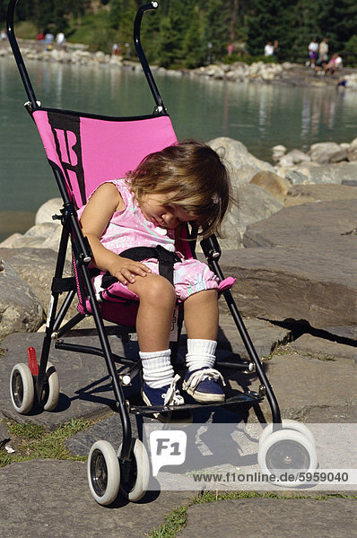 Little girl asleep in pushchair  British Columbia  Canada  North America