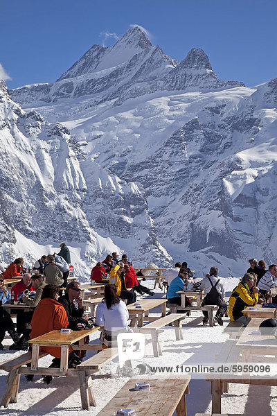 Relaxing outside a mountain restaurant in front of the peaks of the Schreckhorn mountain  4078m  Grindelwald  Jungfrau region  Bernese Oberland  Swiss Alps  Switzerland  Europe