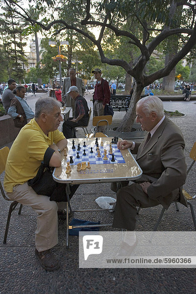 Men playing chess in Plaza de Armas  Santiago  Chile  South America