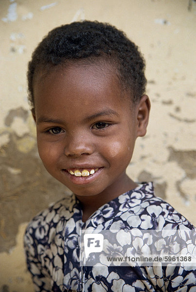 Head and shoulders portrait of an Ethiopian girl  smiling and looking at the camera  Ethiopia  Africa