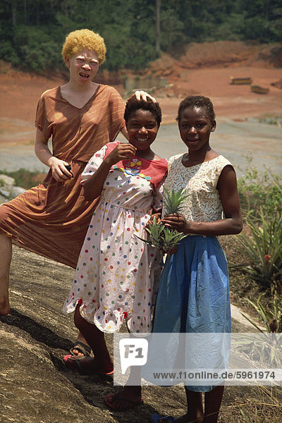 Three local girls  including albino girl  Sangmelima  Cameroon  West Africa  Africa